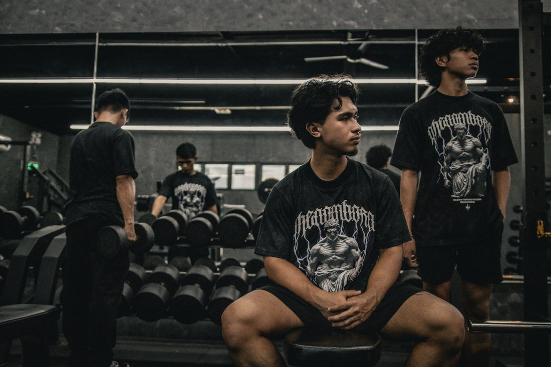 A man sitting on a bench in a gym