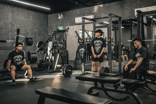 A group of people sitting in a gym